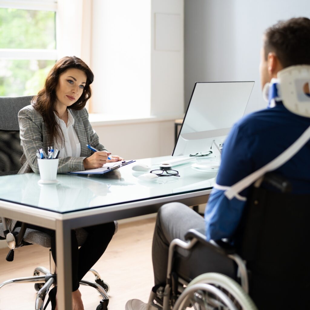 Injured man discussing case with lawyer