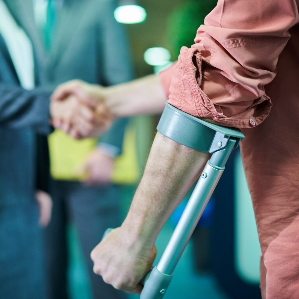 Injured person shaking hands with their lawyer